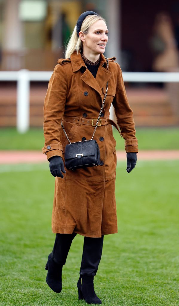 Zara in a a tan suede trench coat