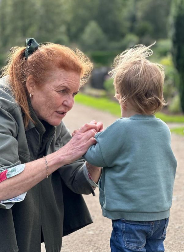 Sarah Ferguson holding her grandson's hand