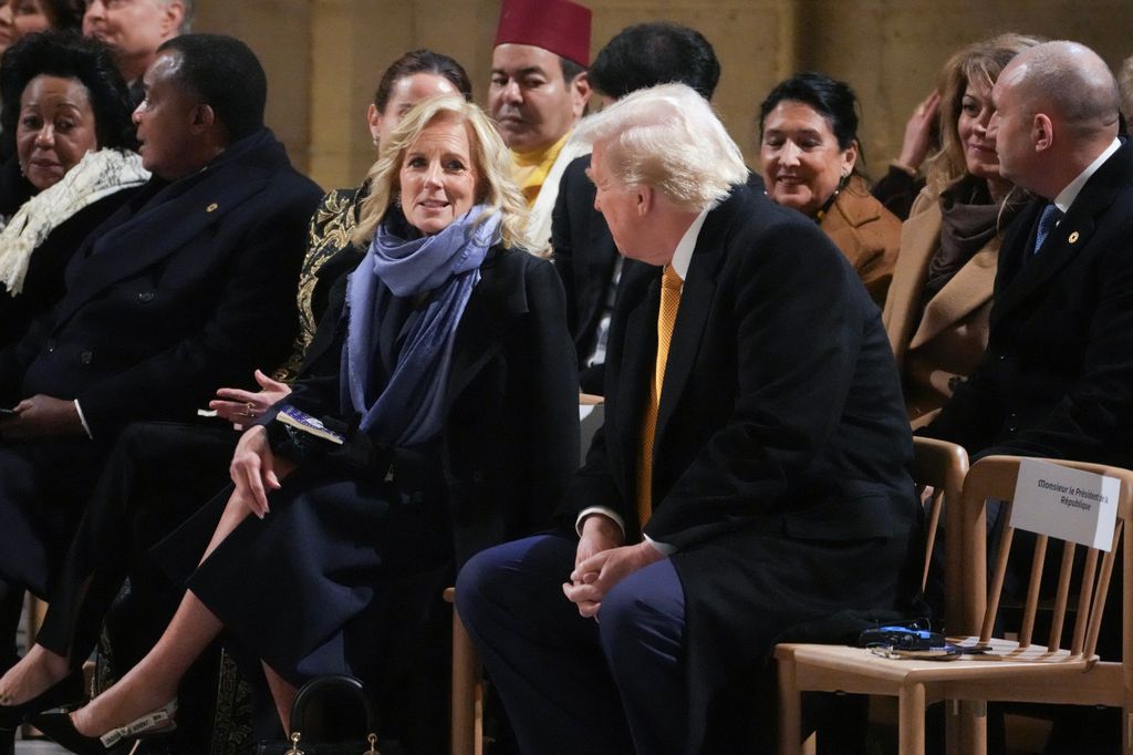 US First Lady Jill Biden (CL) speaks with President-elect Donald Trump sits during a ceremony to mark the re-opening of the landmark Notre-Dame Cathedral