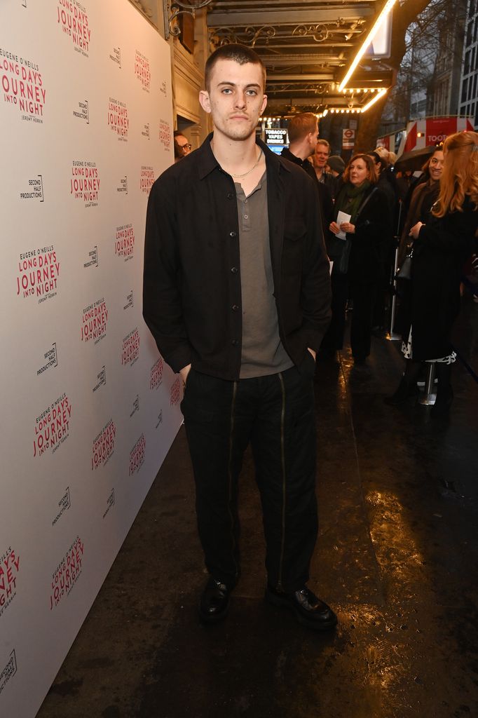 man posing at press night performance in theatre