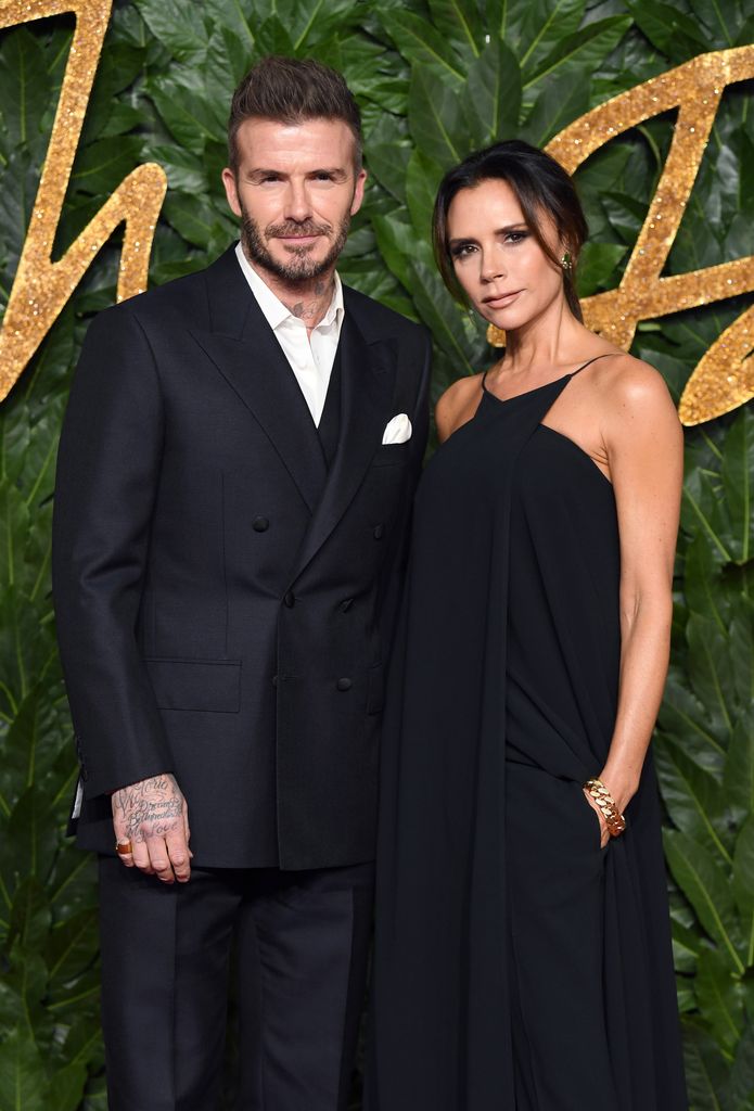 David and Victoria Beckham in black outfits