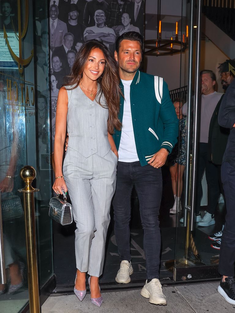 Michelle Keegan in grey waistcoat and trousers leaving Los Angeles venue with husband Mark Wright