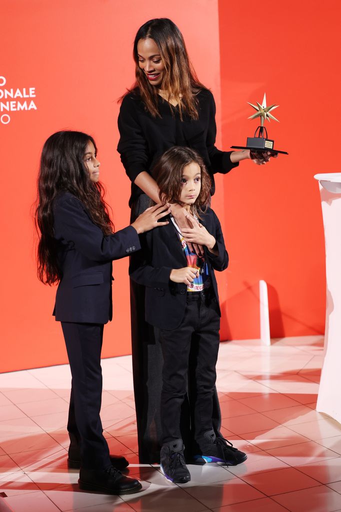 Zoe Saldana and her sons with the Stella della Mole award 