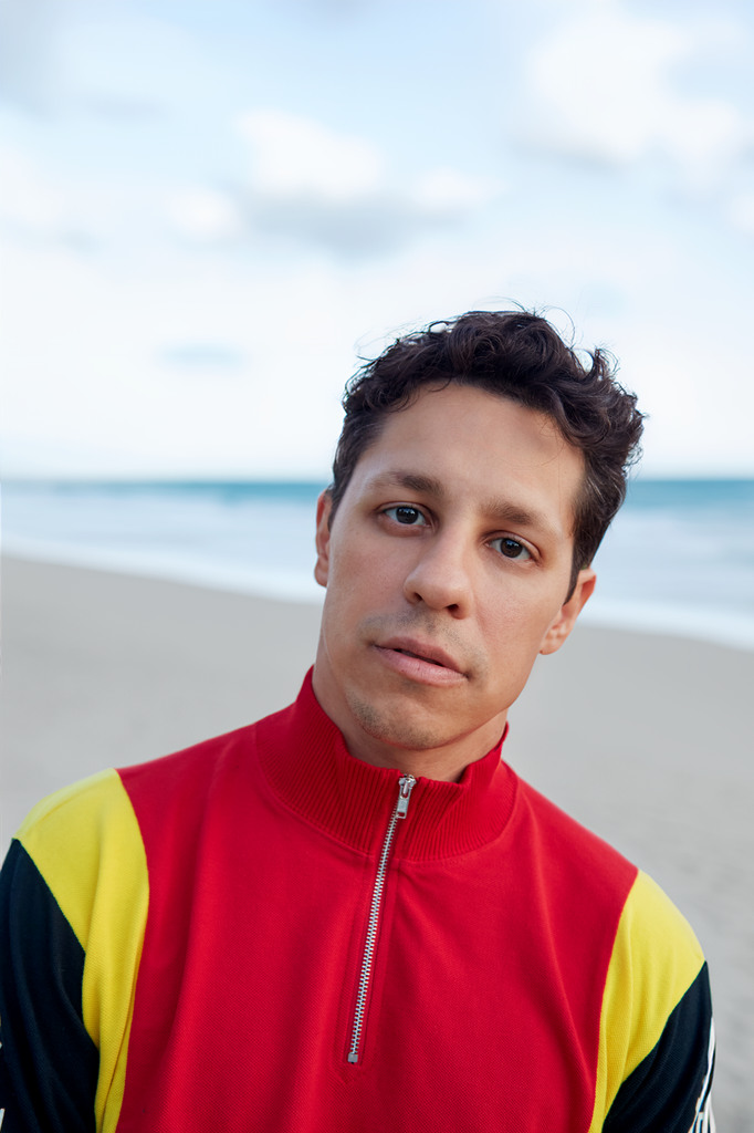 David Del Rio poses on the beach 