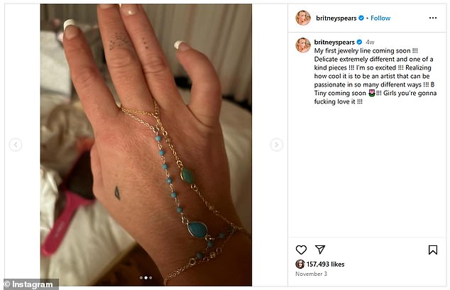 Britney showed a picture of what appeared to be her own hand wearing a silver chain with a series of turquoise stones in it and a separate gold one with a green stone layered on top of her silver piece