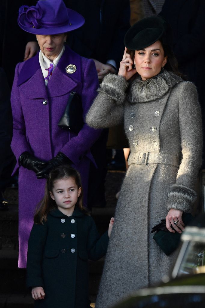 Princess Anne in purple coat with Kate and Charlotte