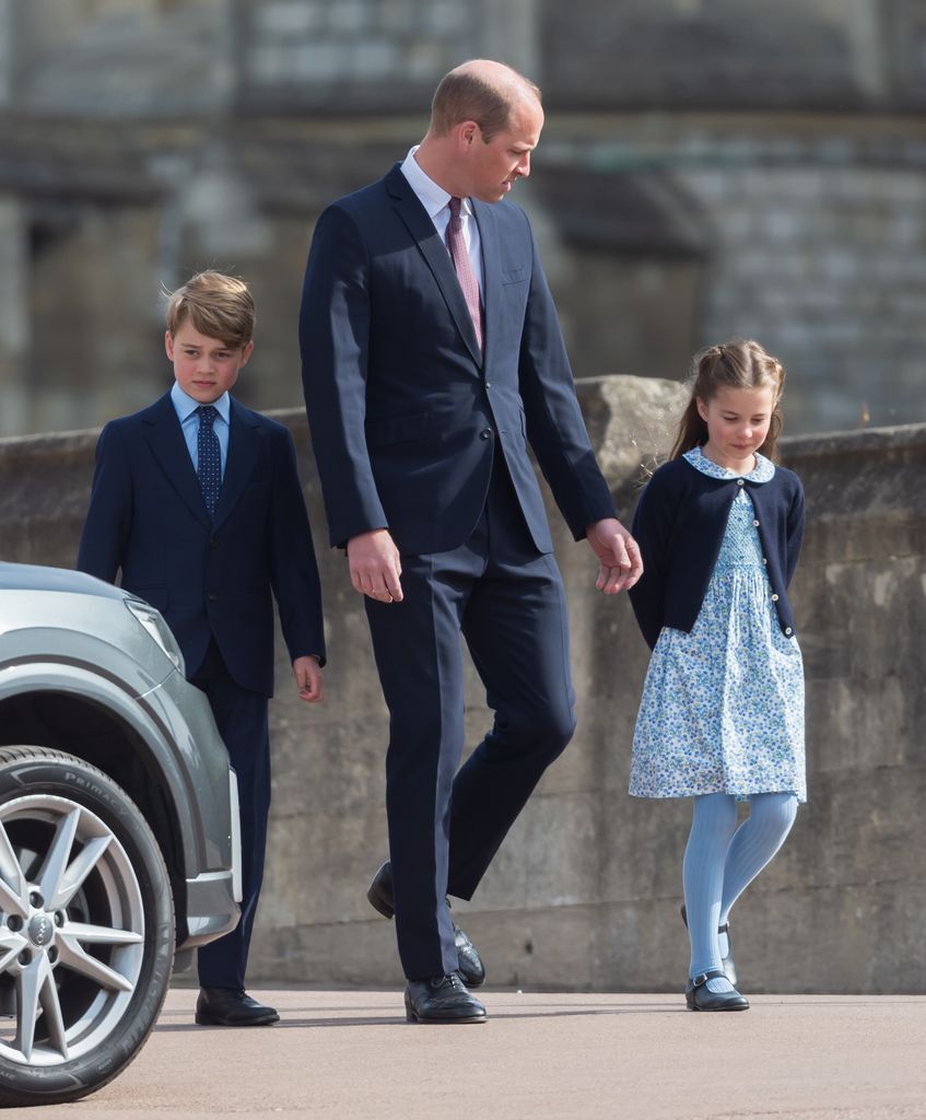 Prince William with his children Prince George and Princess Charlotte as they attend the traditional Easter Sunday Church service at St Georges Chapel in the grounds of Windsor Castle on April 16, 2022 in Windsor, England. 