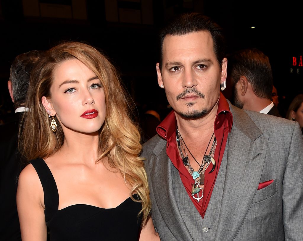 Amber Heard (L) and Johnny Depp attend the "Black Mass" premiere during the 2015 Toronto International Film Festival 