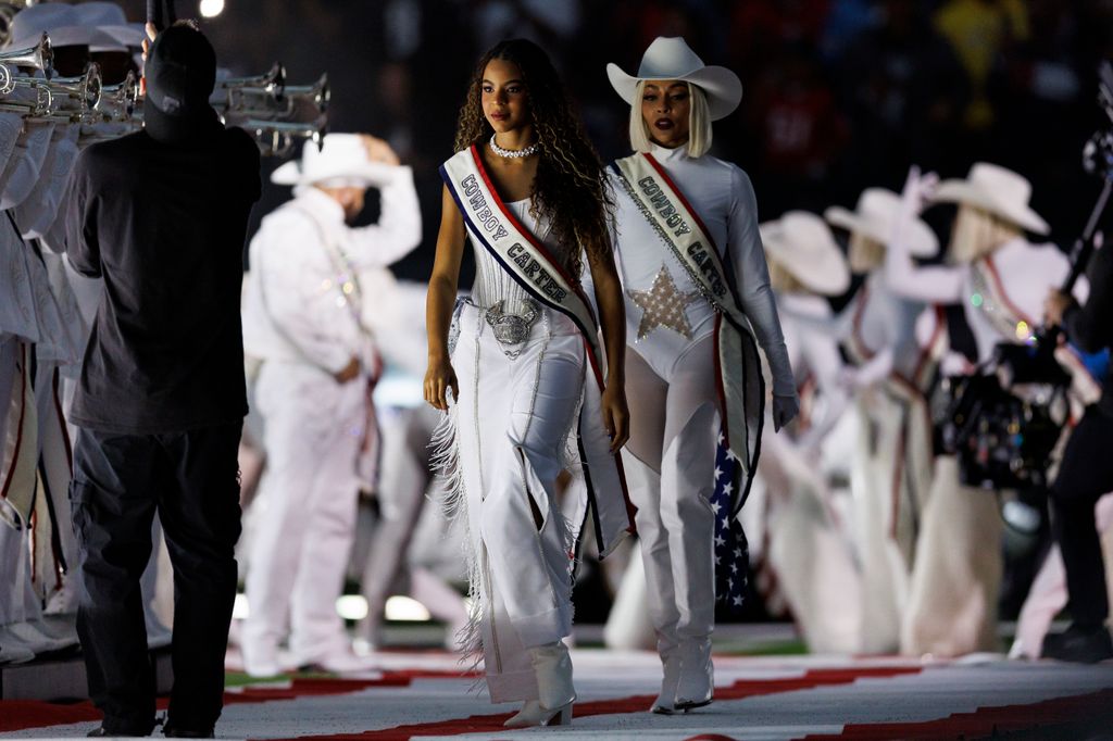 Blue Ivy walks onto the field for the Beyoncé halftime show during an NFL football game between the Baltimore Ravens and the Houston Texans, at NRG Stadium on December 25, 2024 in Houston, Texas