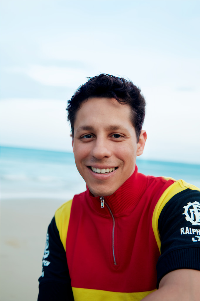 David Del Rio poses on the beach 