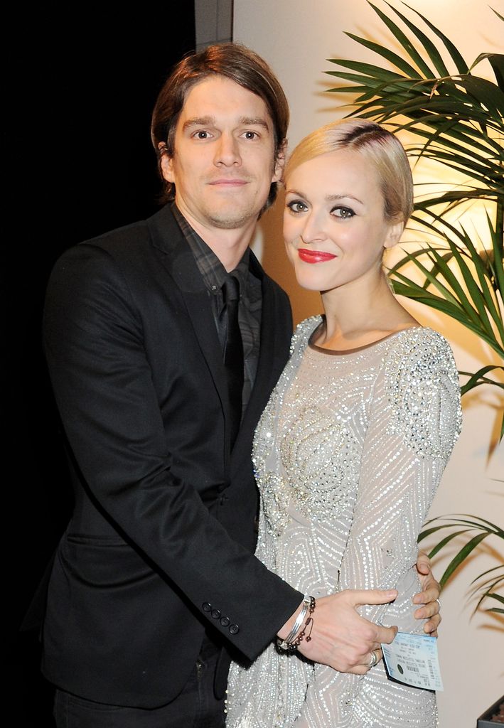 Fearne Cotton in a silver dress with her husband Jesse Wood