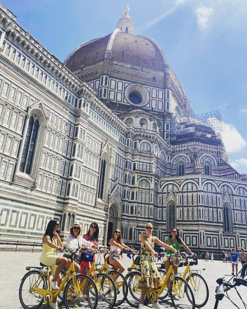 Kitty Spencer on a bike with her friends in Florence