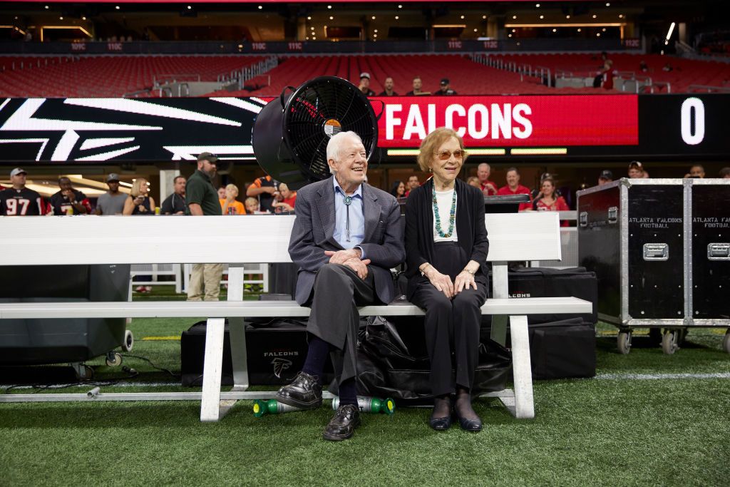 Jimmy Carter sits alongside his wife Rosalyn 