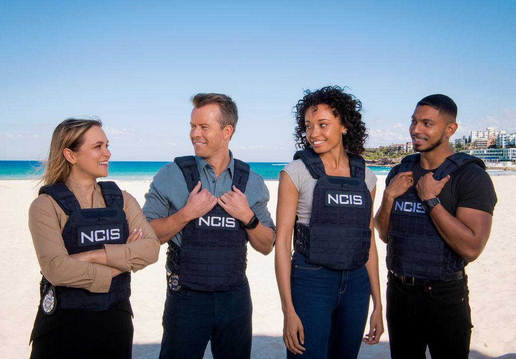 L-R: Tuuli Narkle as AFP LiaisonÂ Officer Constable Evie Cooper, Todd Lasance as AFP LiaisonÂ Officer Sergeant JimÂ  'JD'Â Dempsey, Olivia Swann as NCIS Special Agent Captain Michelle Mackey and Sean Sagar asÂ Special Agent DeShawn Jackson at Bondi Beach, on the set of NCIS: Sydney. 