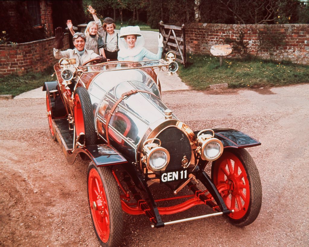 Dick Van Dyke, Heather Ripley, Adrian Hall and Sally Ann Howes sit waving from their seats in the car, in a publicity portrait issued for the film , Chitty Chitty Bang Bang', 1968. The 1968 musical, directed by Ken Hughes, starred Van Dyke as 'Caractacus Potts', Ripley as 'Jemima Potts', Hall as 'Jeremy Potts', and Howes as 'Truly Scrumptious'