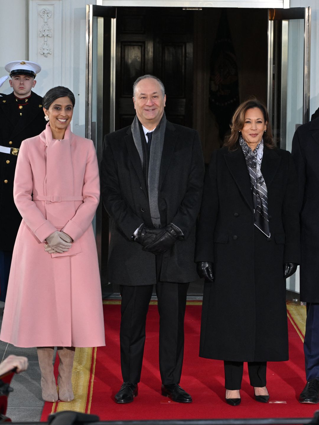 Kamala Harris rocked a structured black overcoat paired with a metallic scarf that shimmered just enough to catch the light. She is stood with Usha Vance, US Second Gentleman Douglas Emhoff and Vice President-elect JD Vance