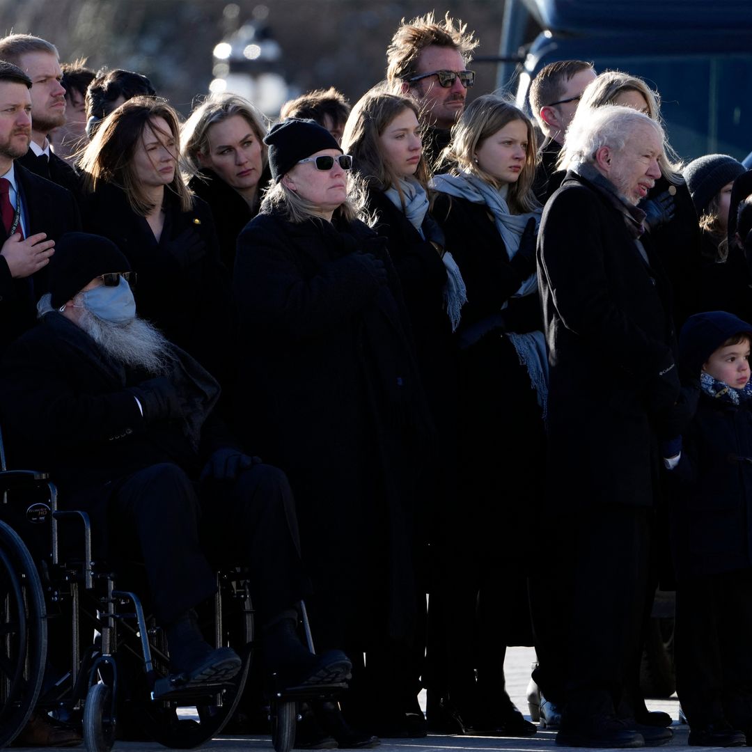 Amy Carter (C, sunglasses), joined by members of the Carter family, watches as the remains of her father, former US President Jimmy Carter, leave the US Capitol for the State Funeral Service at the Washington National Cathedral in Washington, DC, on January 9, 2025.