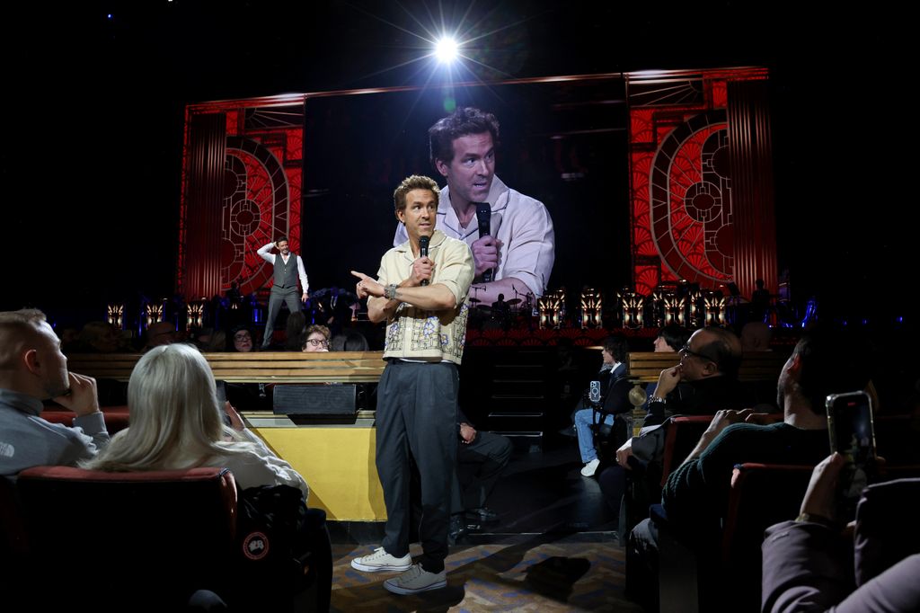 Ryan Reynolds speaks from the crowd as Hugh Jackman performs onstage during Hugh Jackman: From New York, With Love at Radio City Music Hall on January 24, 2025 in New York City