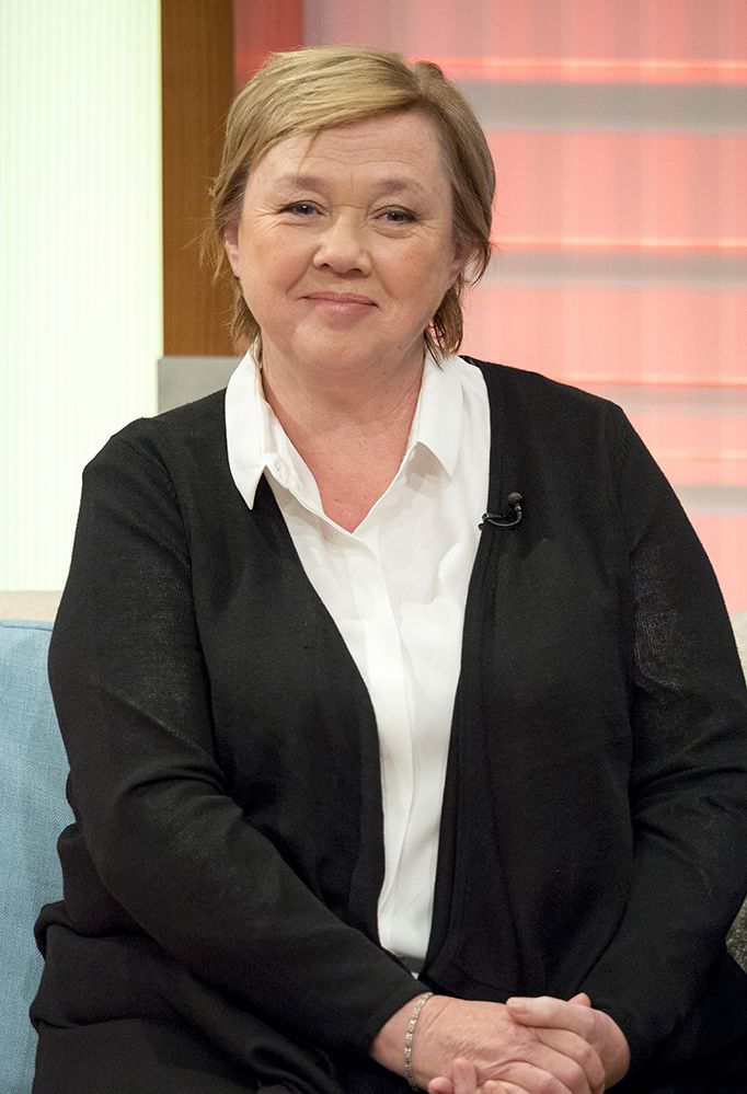 Pauline Quirke wearing a black cardigan and white shirt 