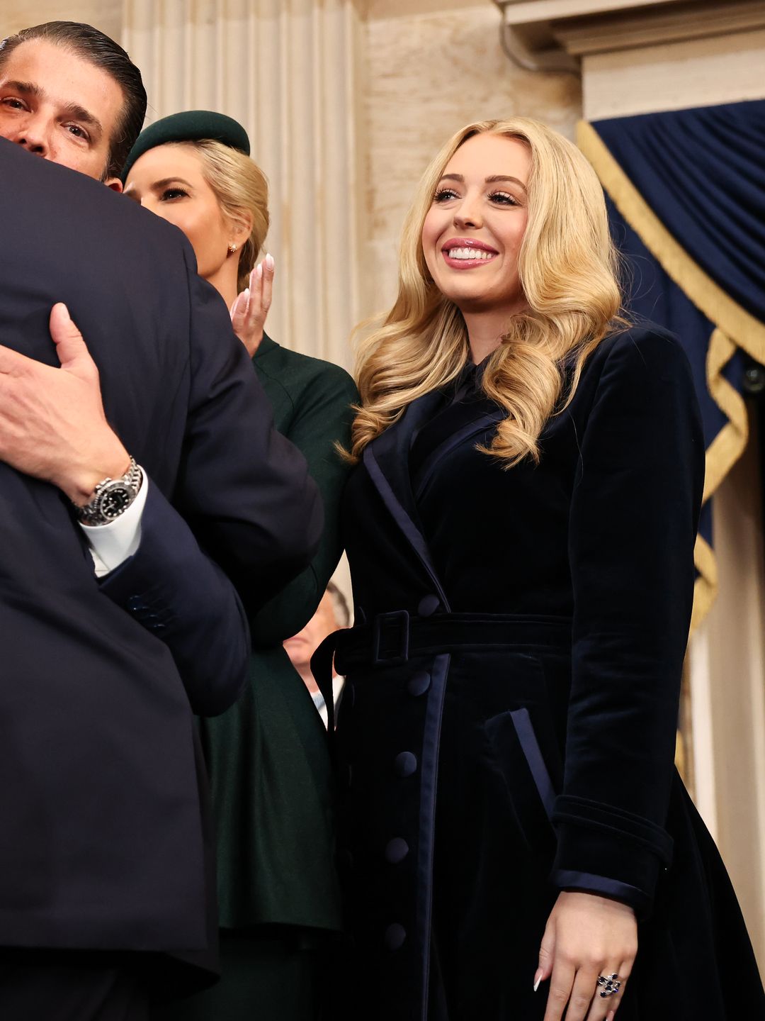 Tiffany Trump brought the drama in a luxurious navy velvet coat-dress with oversized buttons and a cinched waist. The rich, plush fabric practically screamed winter glam. Known for embracing bold textures, Tiffany’s outfit was a perfect nod to her love of modern tailoring with a touch of opulence.