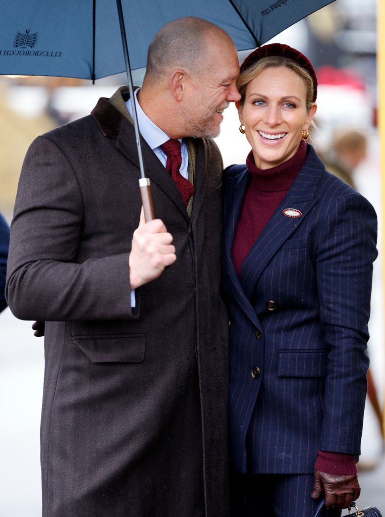 couple at races with umbrella