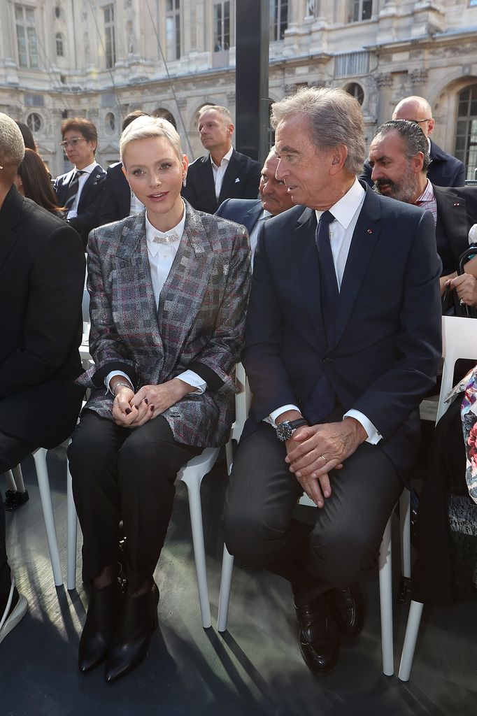 Princess Charlene of Monaco and Bernard Arnault attend the Louis Vuitton Womenswear Spring/Summer 2023 show as part of Paris Fashion Week  on October 04, 2022 in Paris, France.