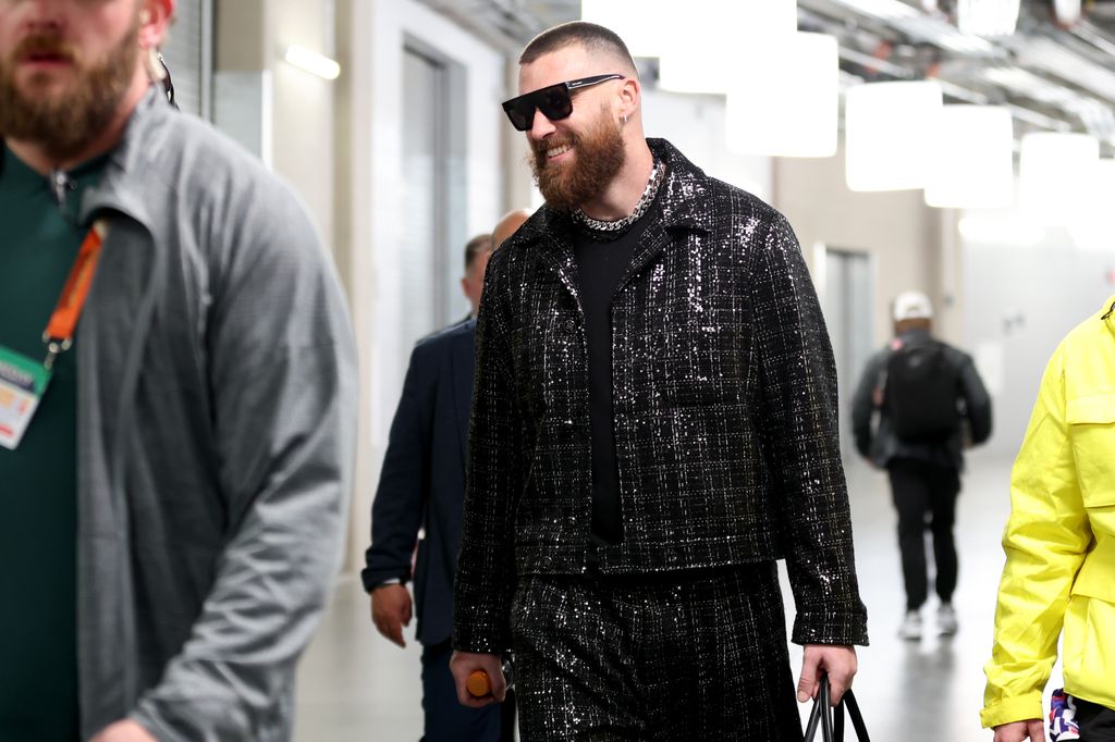 Travis Kelce #87 of the Kansas City Chiefs walks through the tunnel as he leaves the stadium after defeating the San Francisco 49ers 25-22 in overtime during Super Bowl LVIII at Allegiant Stadium on February 11, 2024 