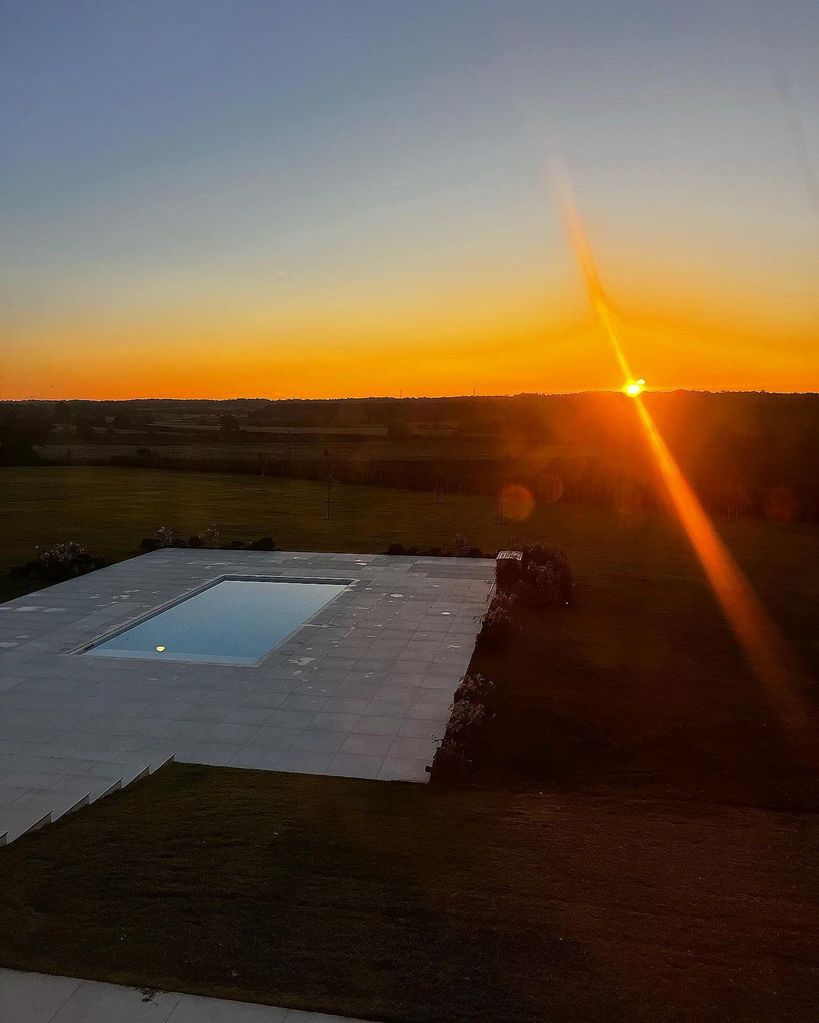 The sunrise over Mark and Michelle's outdoor swimming pool