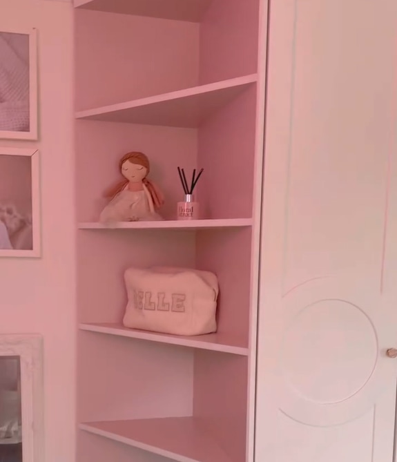 pink shelves in stacey solomon's house with a diffuser on the shelf