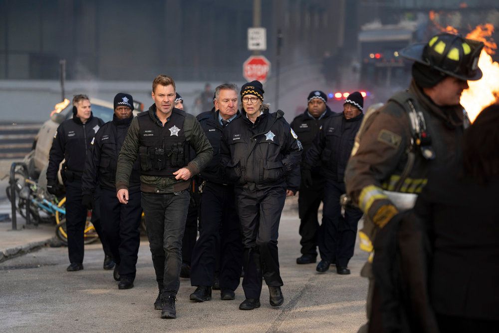 Patrick John Flueger as Officer Adam Ruzek, Amy Morton as Desk Sgt. Trudy Platt in Chicago PD