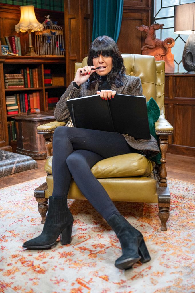 Claudia Winkleman black heel suede boots on The Traitors