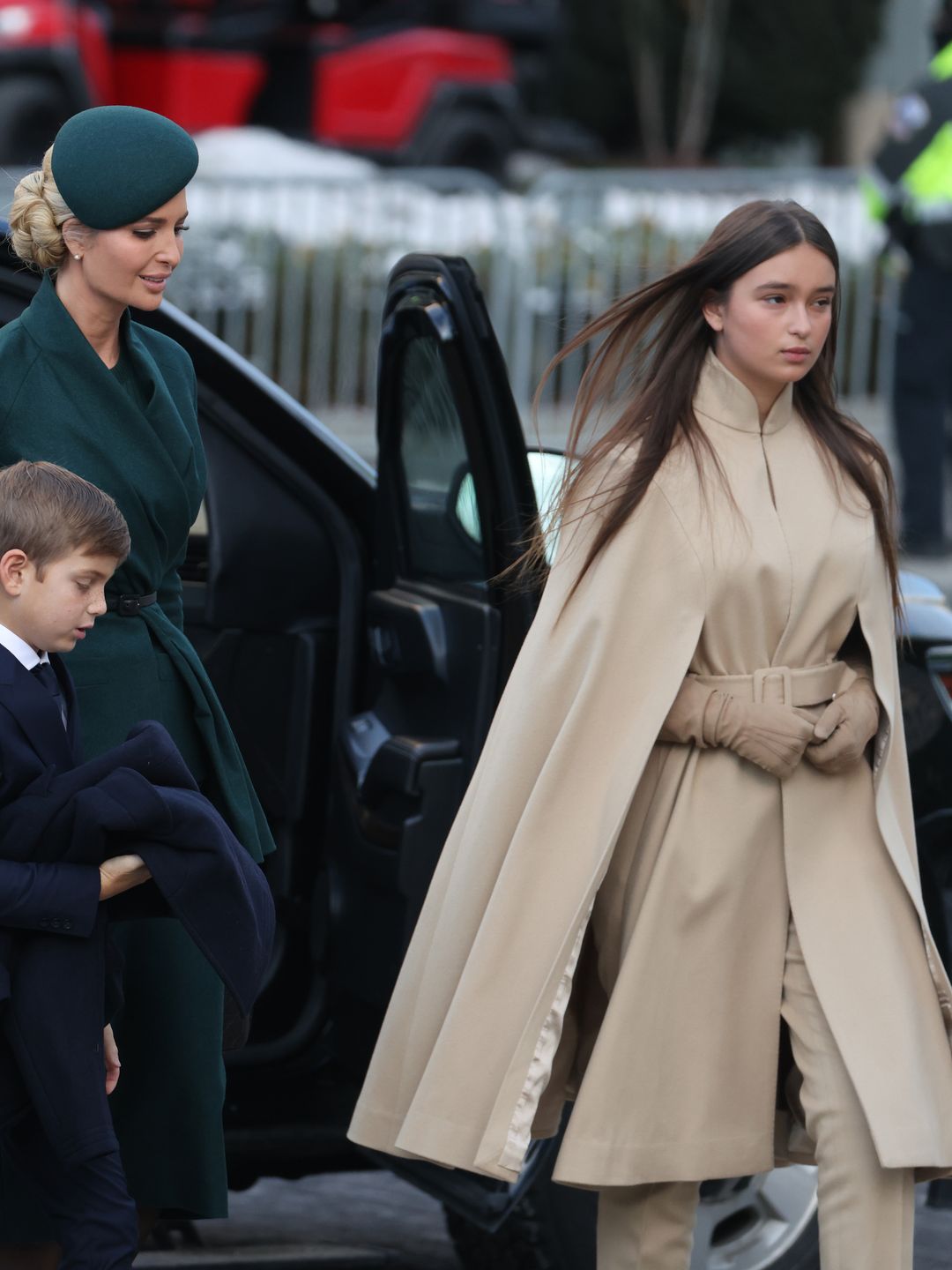 Arabella Kushner wears a camel cape-coat, perfectly paired with matching gloves and boots to the Inauguration. 