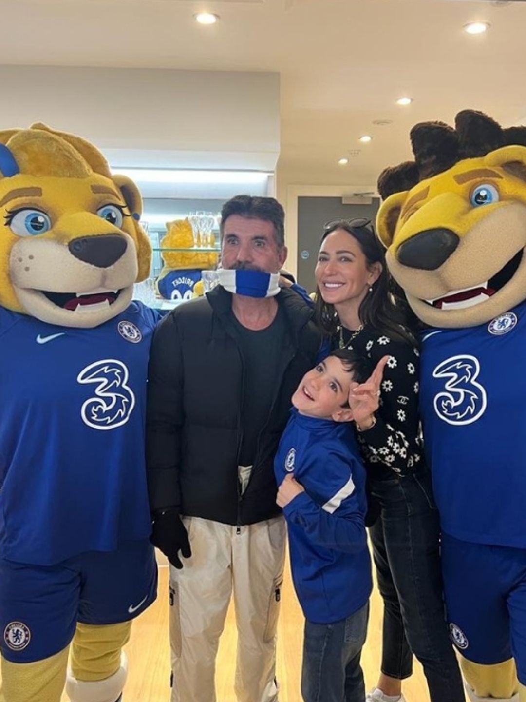 Simon Cowell, Lauren Silverman and son Eric with Chelses mascots