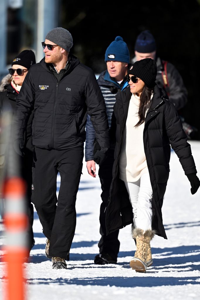 Harry and Meghan holding hands in Whistler