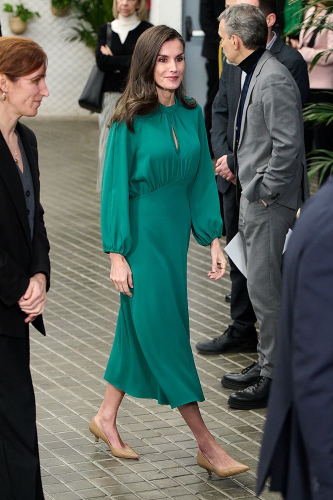 Queen Letizia walking in a green dress by Dandara Spain