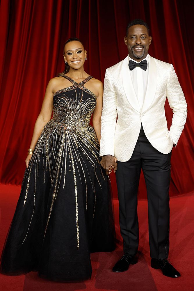 Sterling K. Brown and Ryan Michelle Bathe holding hands on the red carpet