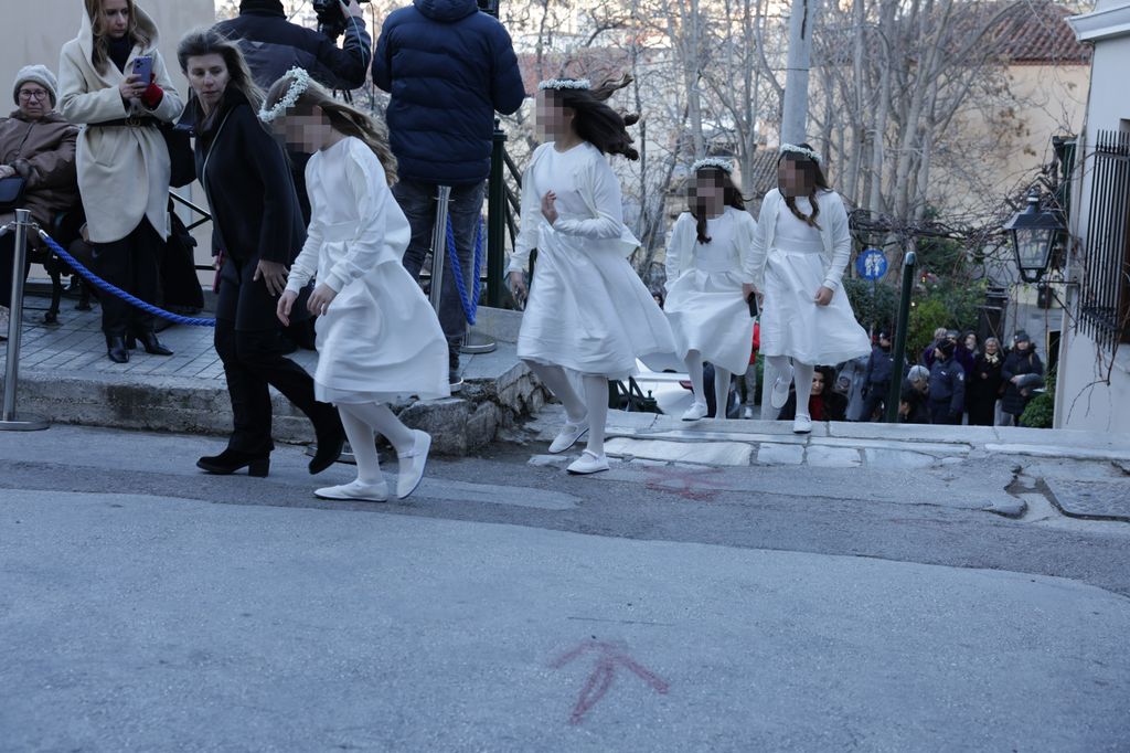 Four bridesmaids in white dresses arriving at Prince Nikolaos of Greece's royal wedding