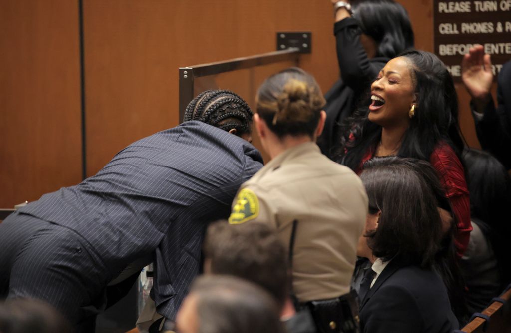 He jumped over the stand to embrace Rihanna and his family