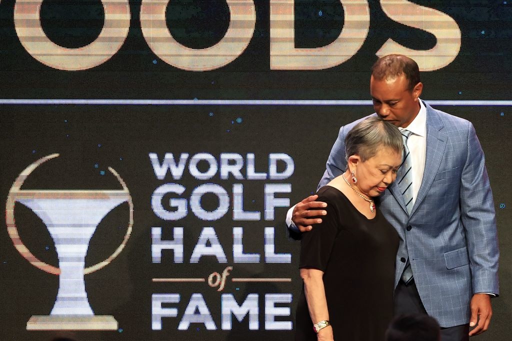 Tiger Woods and his mother Kultida Woods react as they pose for photos prior to his induction at the 2022 World Golf Hall of Fame Induction at the PGA TOUR Global Home on March 09, 2022 in Ponte Vedra Beach, Florida