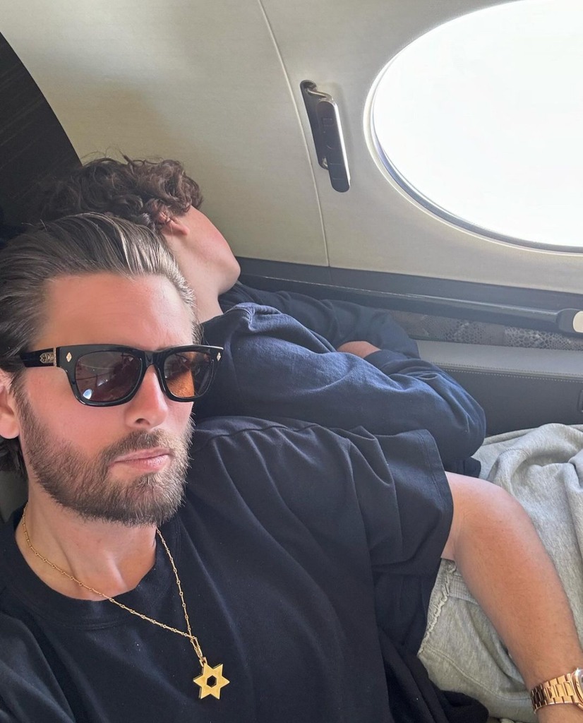 Photo shared by Scott Disick on Instagram July 23, 2024 featuring his son Mason sleeping next to him as they travel in their private jet