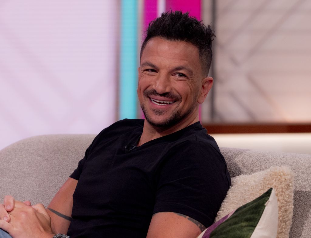 Peter Andre laughing in a black jumper