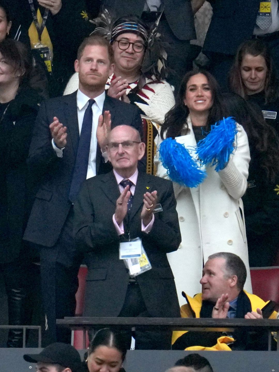 Prince Harry and Meghan Markle applauding