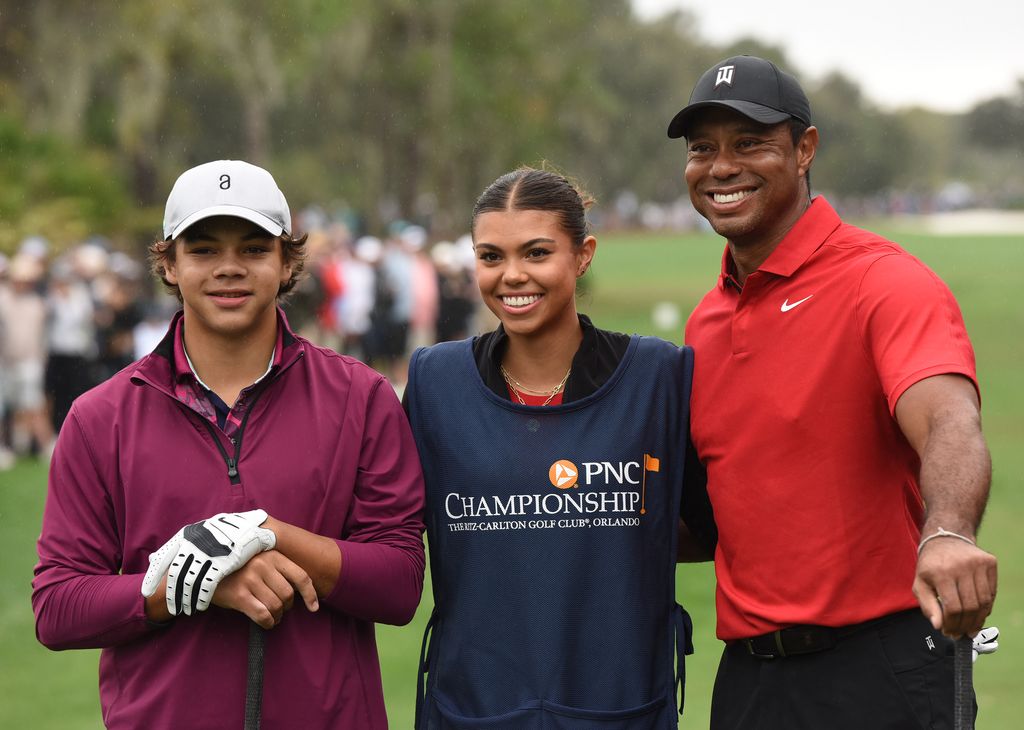 tiger woods on gold course with kids sam and charlie