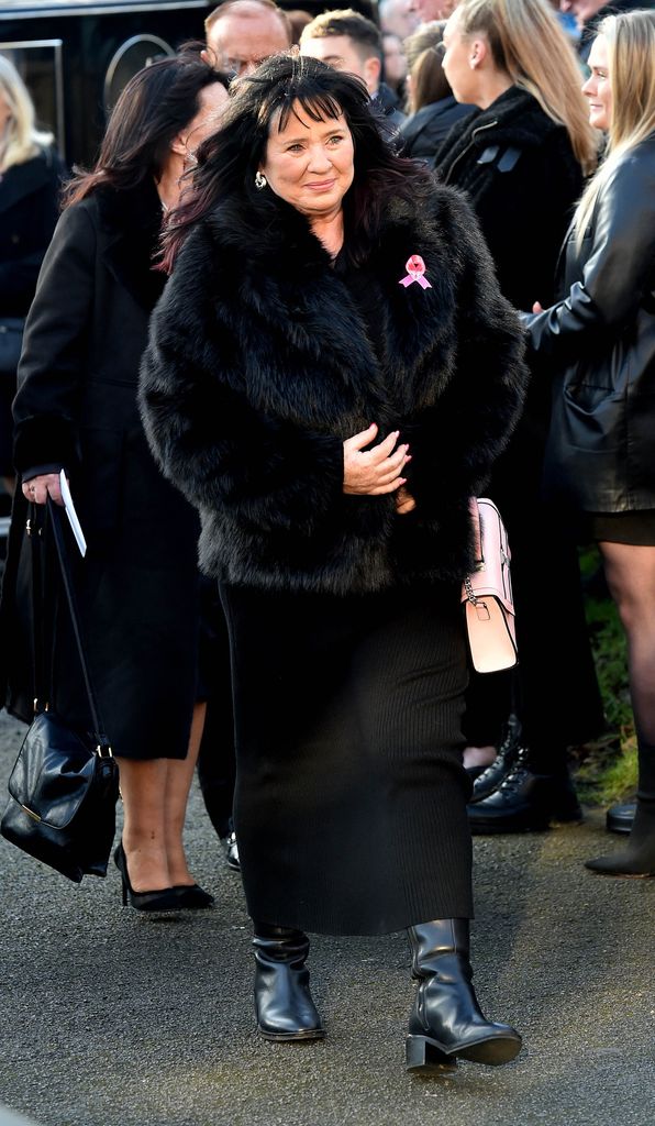 Coleen Nolan in black dress and fur coat