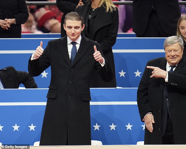 Some online users said they believed the dancer to have been a deliberately planted a fake Barron Trump lookalike as an artistic jab at the current political climate