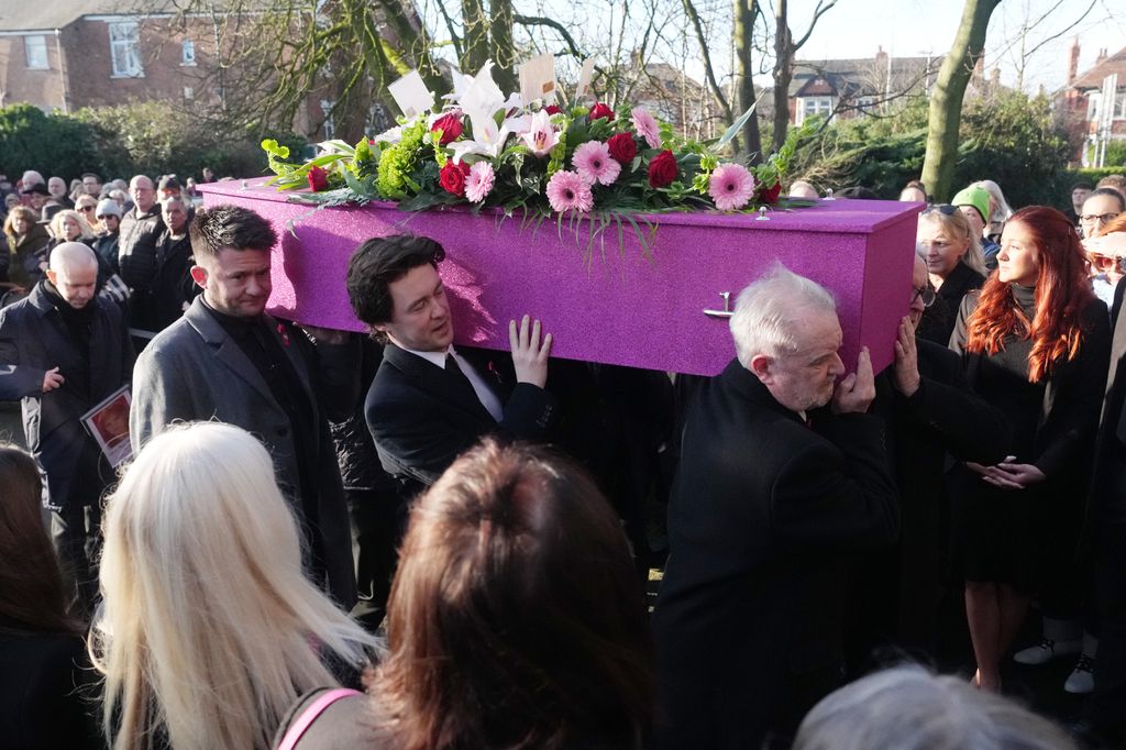 The coffin is carried into the funeral of Linda Nolan 