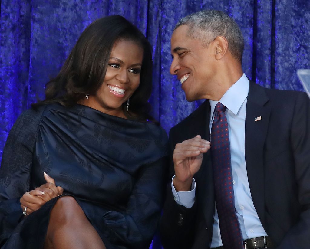 President Barack Obama and first lady Michelle Obama participate in the unveiling of their official portraits during a ceremony at the Smithsonian's National Portrait Gallery, on February 12, 2018 in Washington, DC. The portraits were commissioned by the Gallery, for Kehinde Wiley to create President Obama's portrait, and Amy Sherald that of Michelle Obama.  (Photo by Mark Wilson/Getty Images)