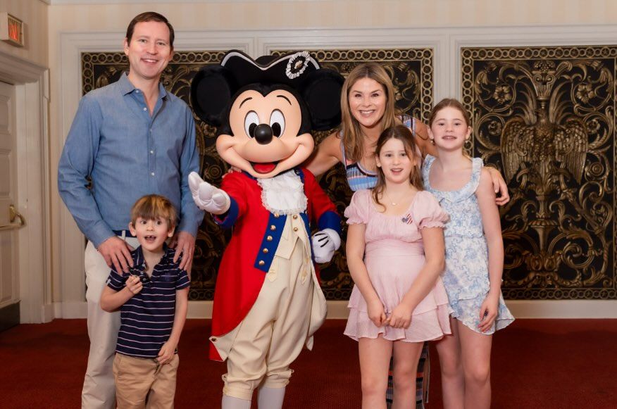 In another photo, Jenna was pictured in a striped summer dress as she posed with her husband and children 