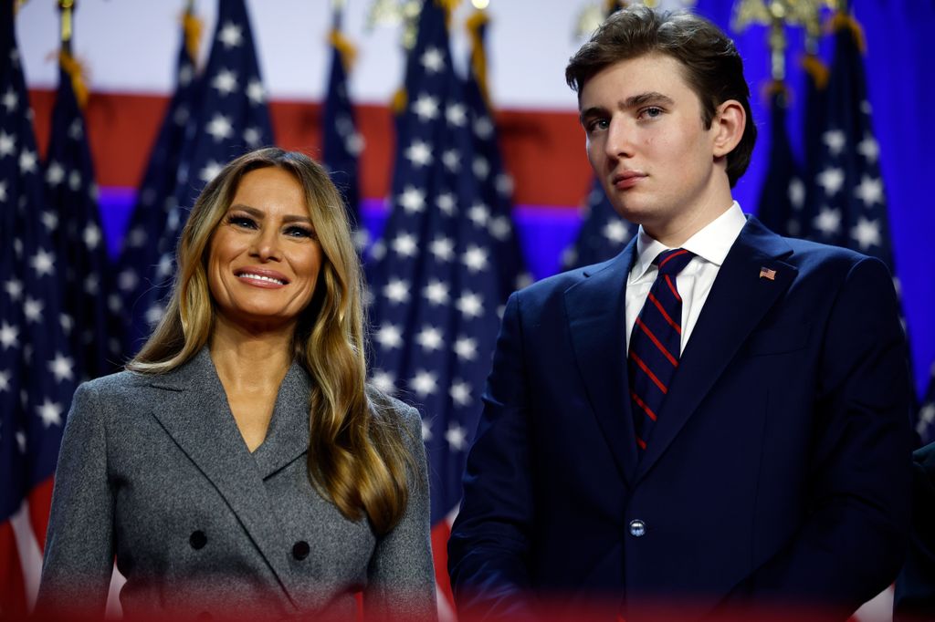 Former first lady Melania Trump and Barron Trump look on as Republican presidential nominee, former U.S. President Donald Trump speaks during an election night event at the Palm Beach Convention Center on November 06, 2024 in West Palm Beach, Florida. Americans cast their ballots today in the presidential race between Republican nominee former President Donald Trump and Vice President Kamala Harris, as well as multiple state elections that will determine the balance of power in Congress