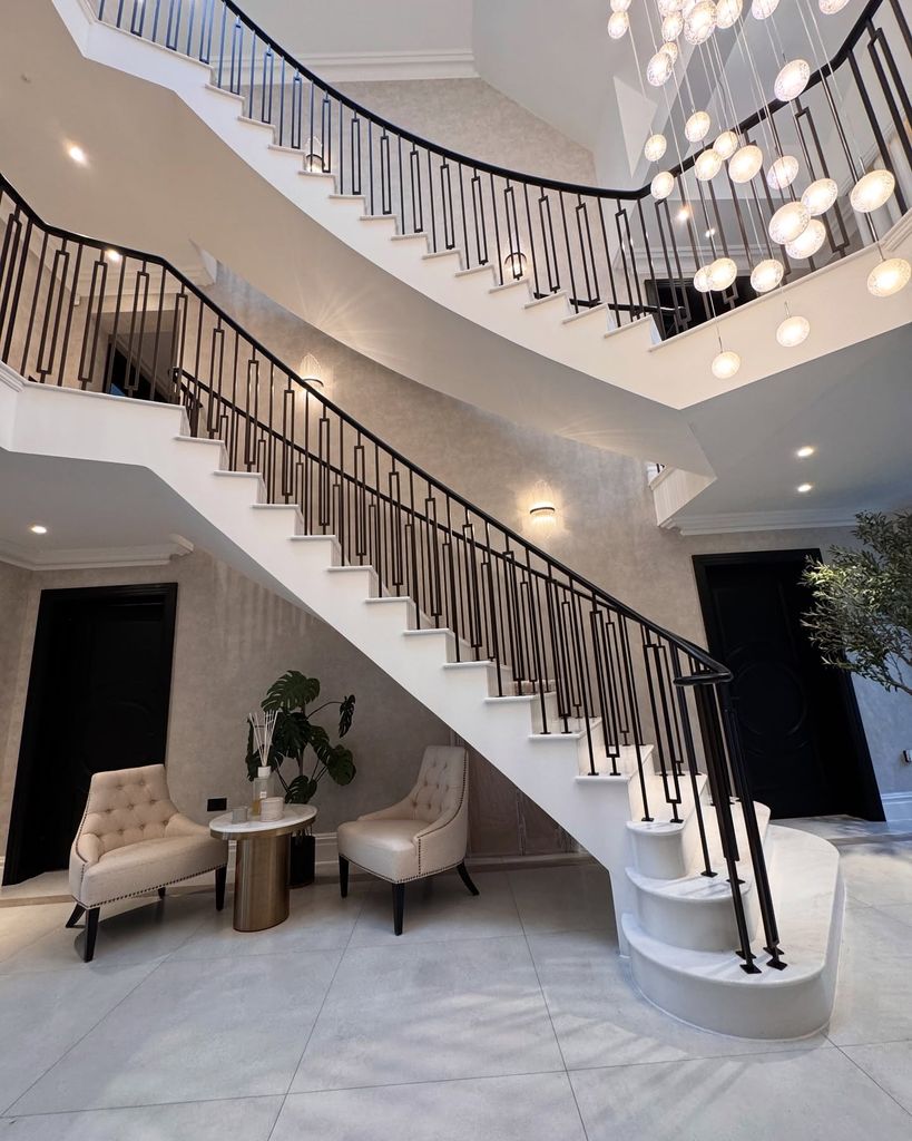 grand white entryway with staircase 